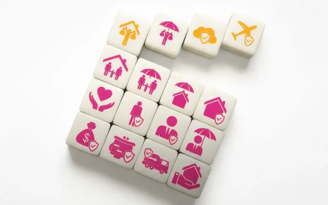 Tiles with pink insurance icons (home, umbrella, health, travel, money) arranged on a white background for protection concepts